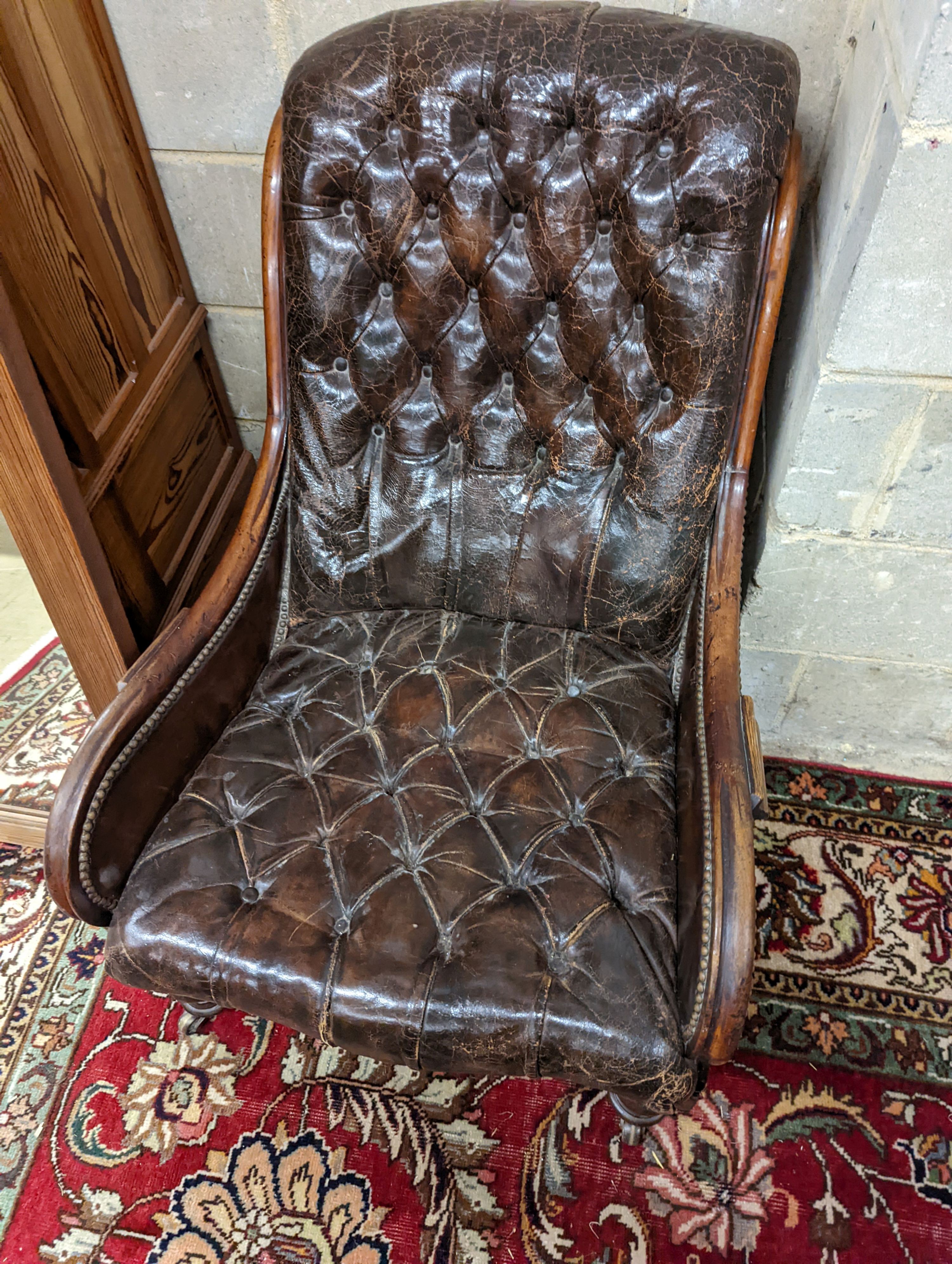 A late 19th century leather button back chair. H-90cm.